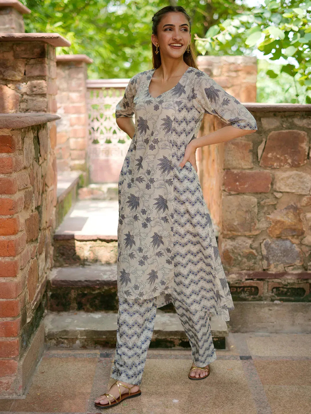 Girls Beige Printed Kurti With Red Palazzos
