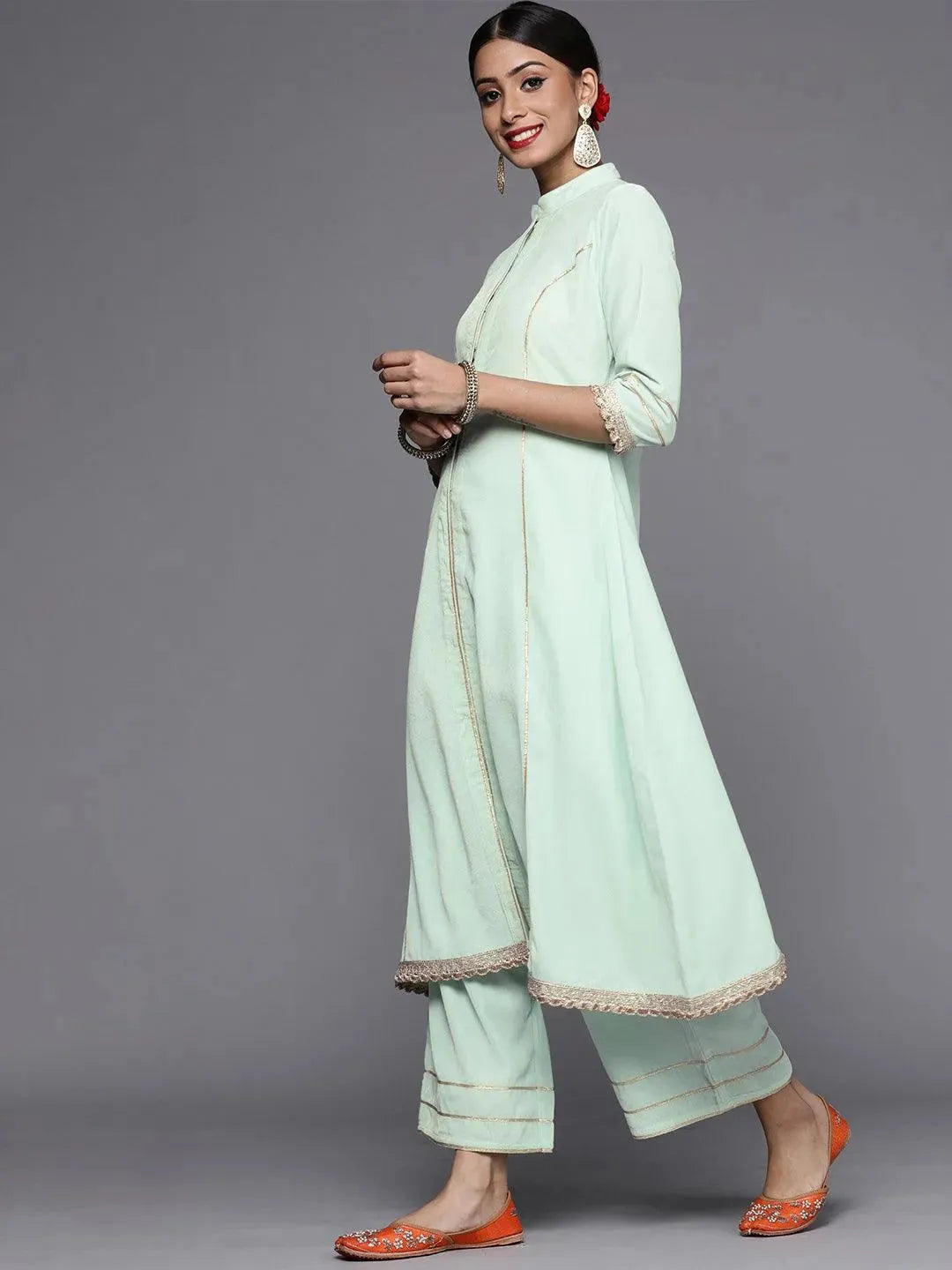 Green Solid Velvet A-Line Kurta With Palazzos & Dupatta
Green Solid Velvet A-Line Kurta With Palazzos & Dupatta