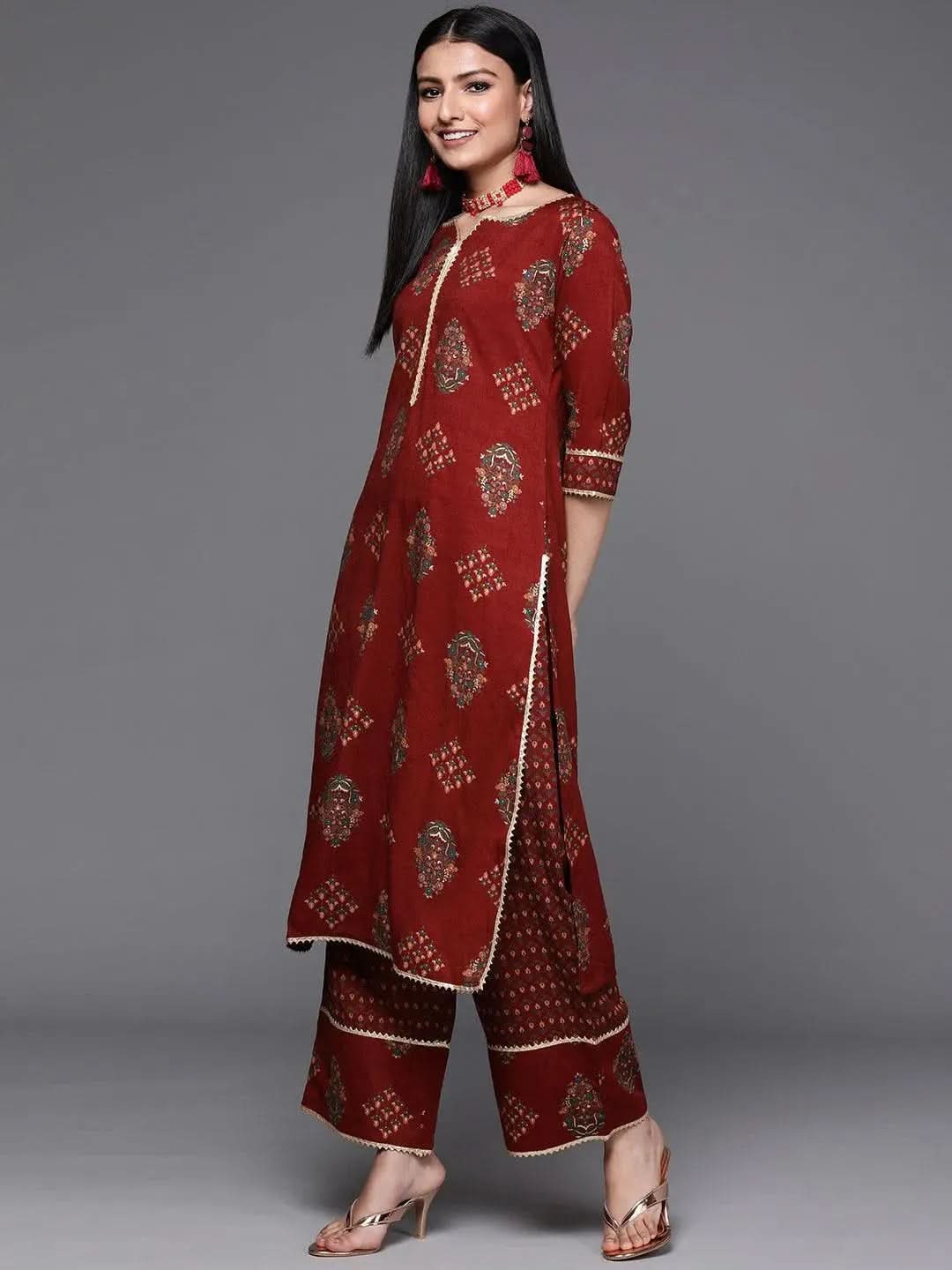 Maroon Printed Rayon Straight Kurta With Palazzos & Dupatta
Maroon Printed Rayon Straight Kurta With Palazzos & Dupatta