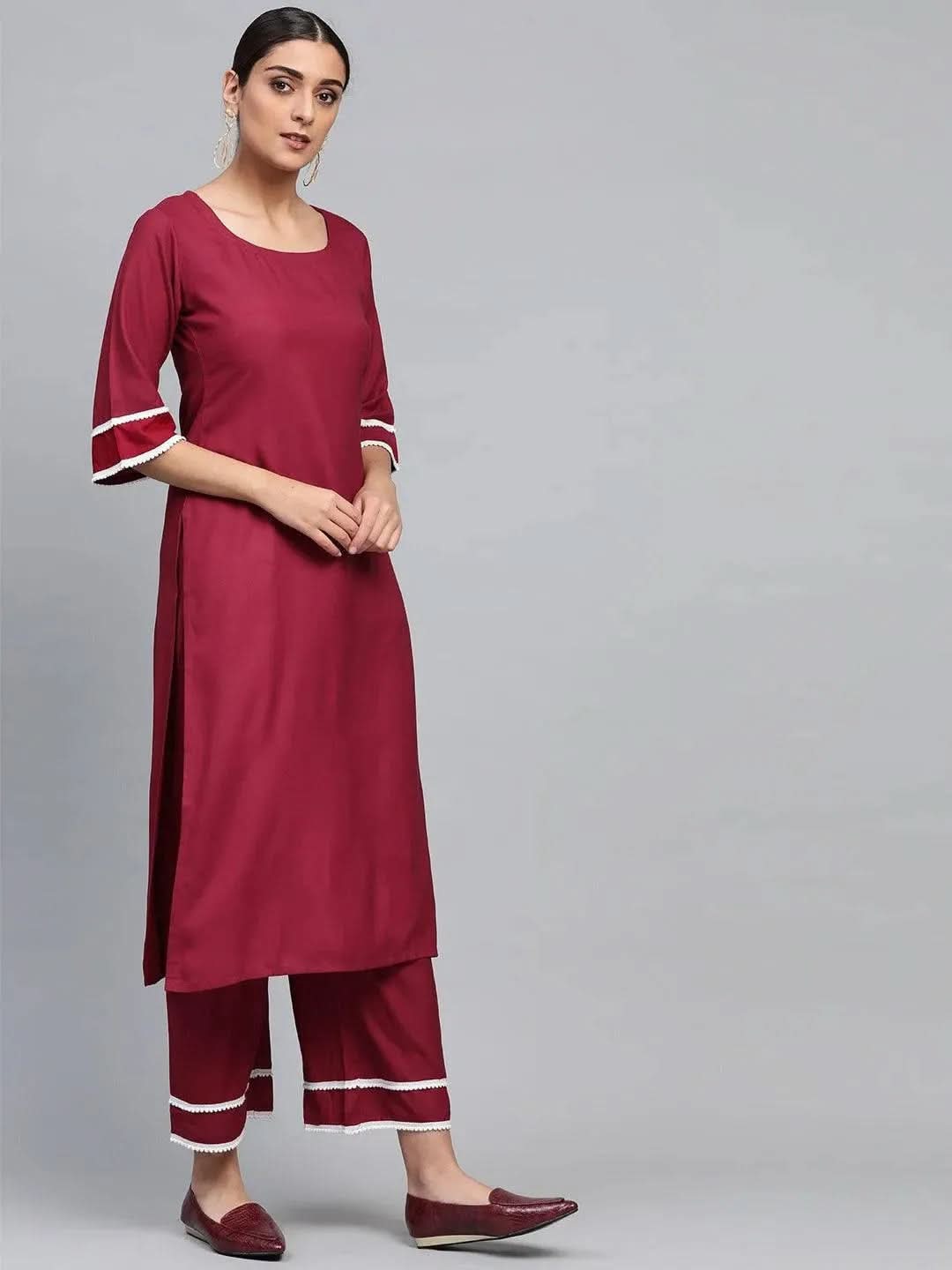 Maroon Solid Polyester Straight Kurta With Palazzos & Dupatta
Maroon Solid Polyester Straight Kurta With Palazzos & Dupatta
