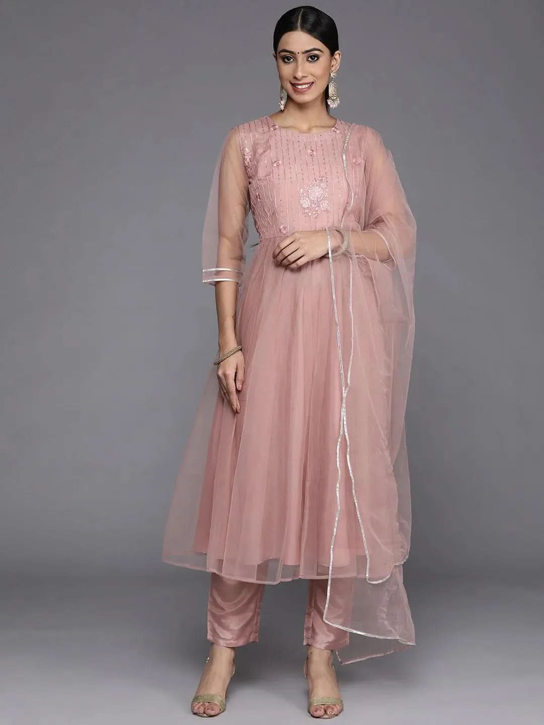 Mauve Embroidered Net Anarkali Kurta With Trousers & Dupatta
Mauve Embroidered Net Anarkali Kurta With Trousers & Dupatta