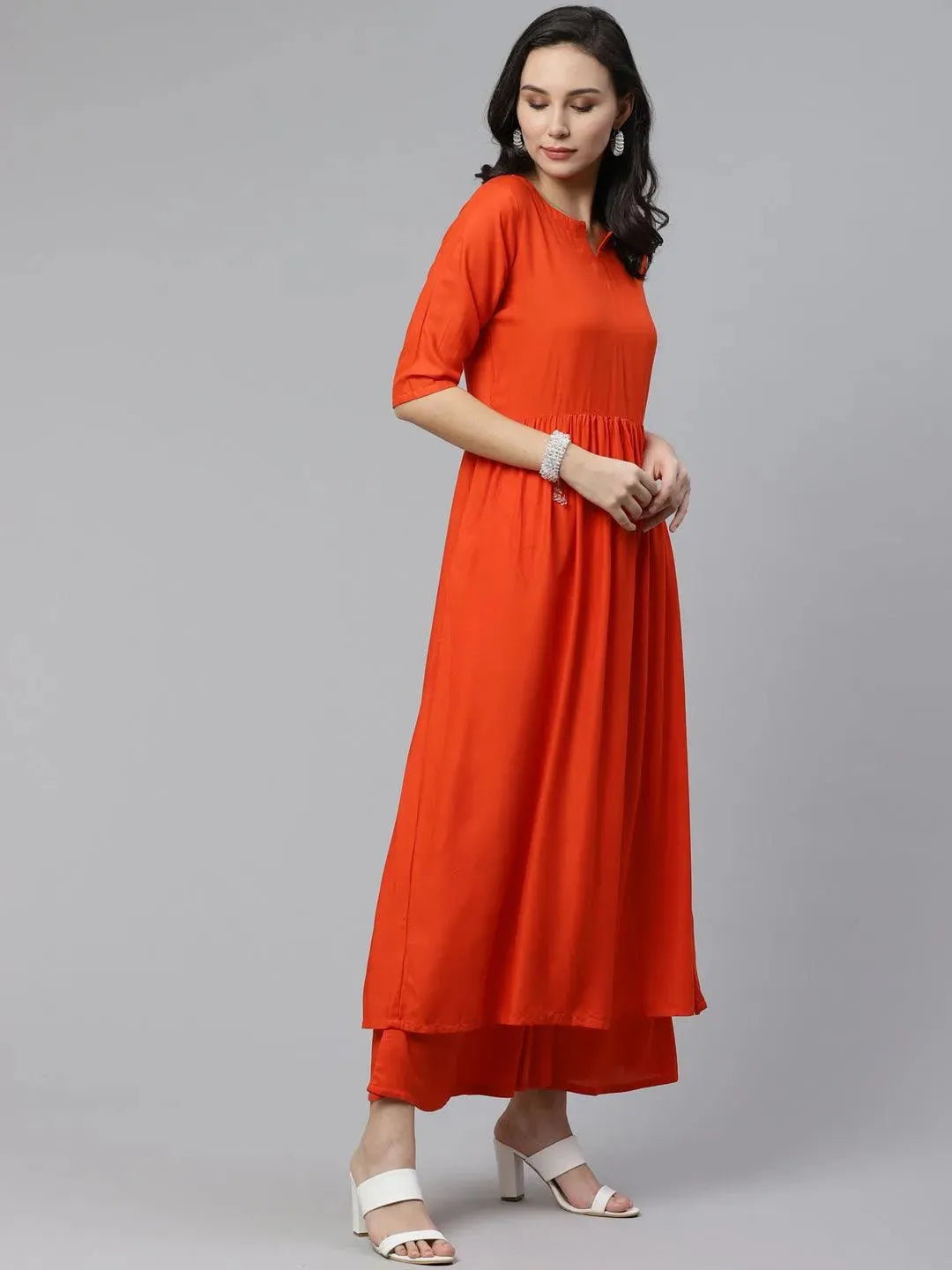 Orange Solid Rayon Anarkali Kurta With Palazzos & Dupatta
Orange Solid Rayon Anarkali Kurta With Palazzos & Dupatta