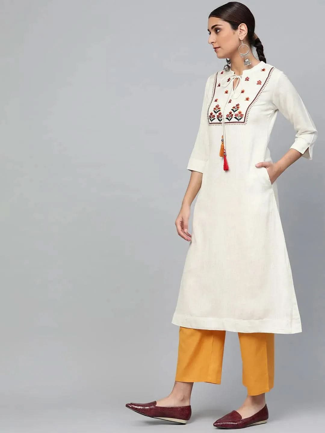 White Embroidered Cotton A-Line Kurta With Palazzos
White Embroidered Cotton A-Line Kurta With Palazzos