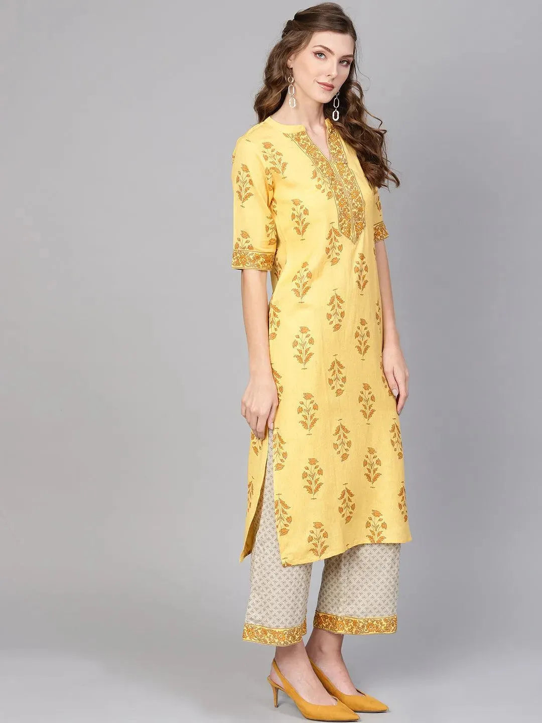 Yellow Printed Cotton Straight Kurta With Palazzos
Yellow Printed Cotton Straight Kurta With Palazzos