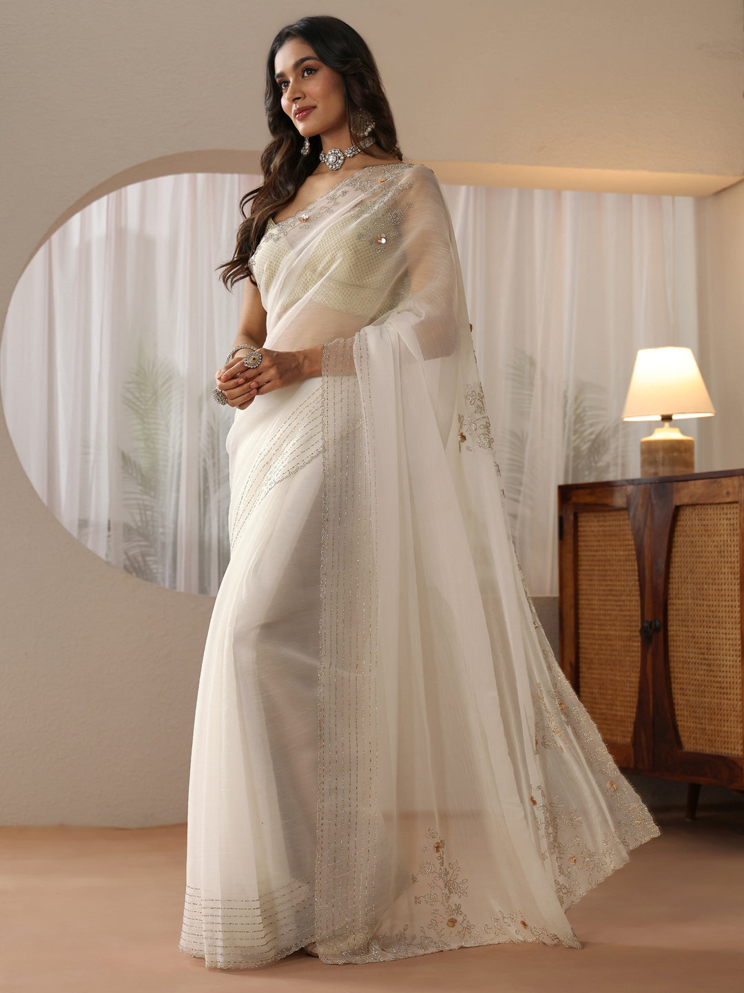  Cream Georgette Saree with Embellished Border 