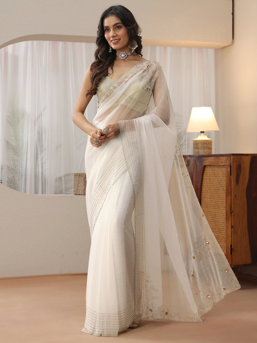  Cream Georgette Saree with Embellished Border 