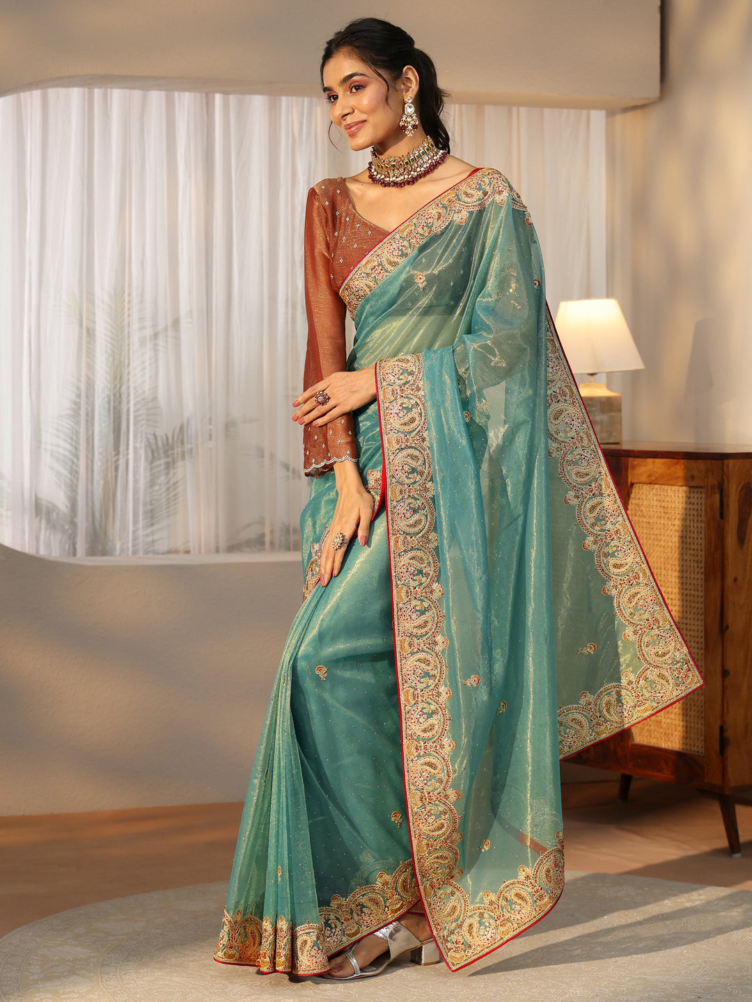  Libas Aqua Blue Net Saree with Embellished Paisley Border 