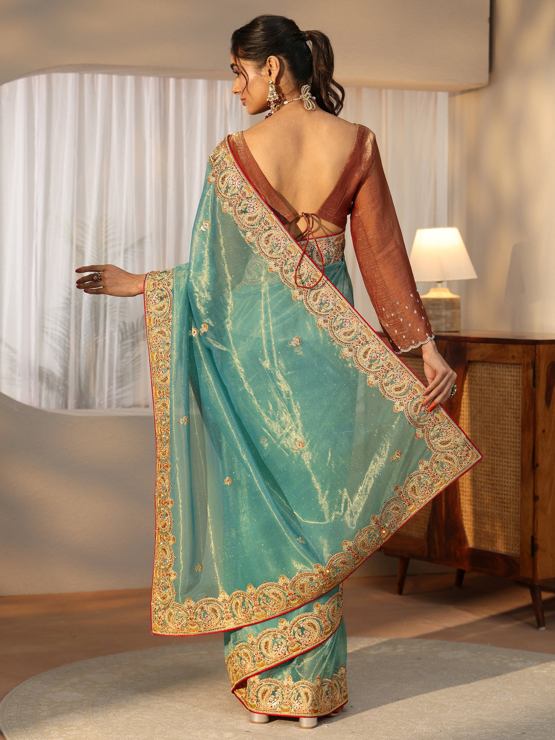  Libas Aqua Blue Net Saree with Embellished Paisley Border 