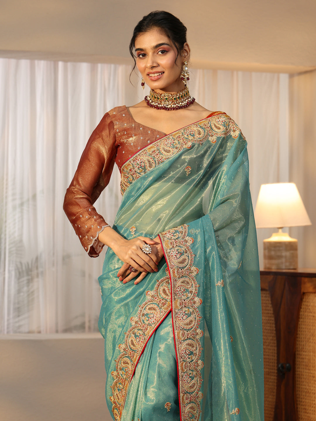  Libas Aqua Blue Net Saree with Embellished Paisley Border 