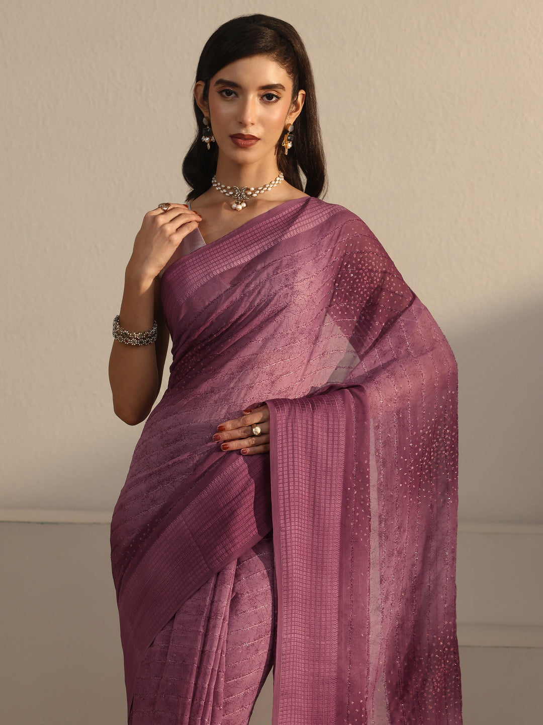  Libas Mauve Striped Georgette Tassel Saree with Embellishments 