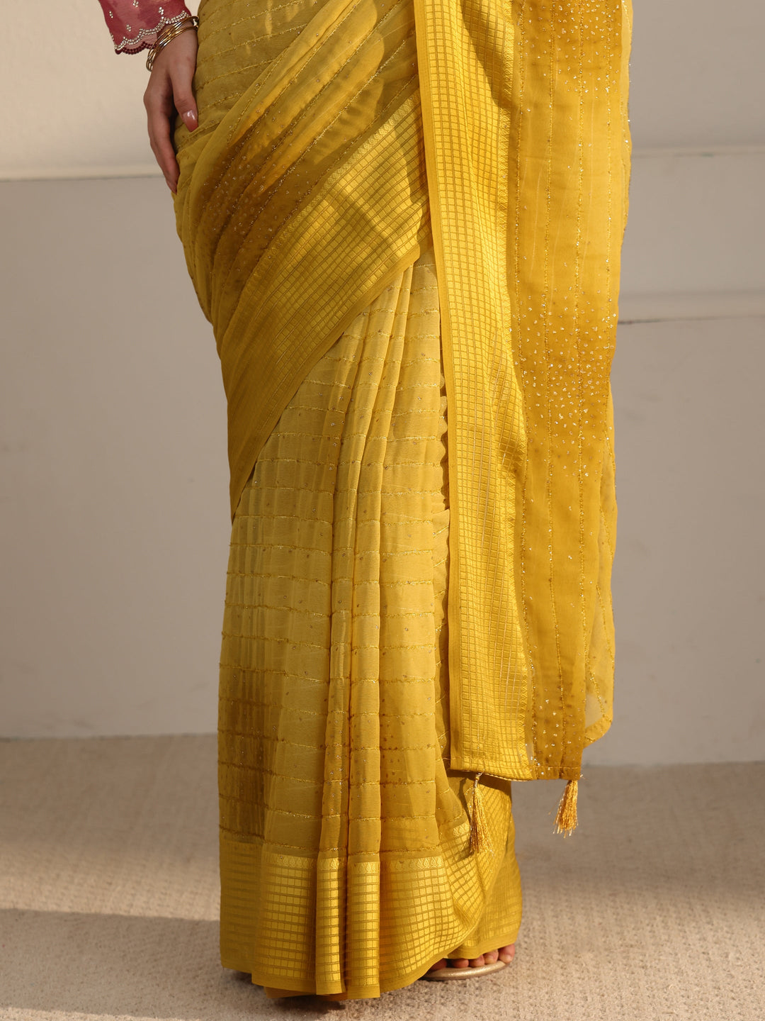  Libas Mustard Striped Georgette Tassel Saree with Embellishments 