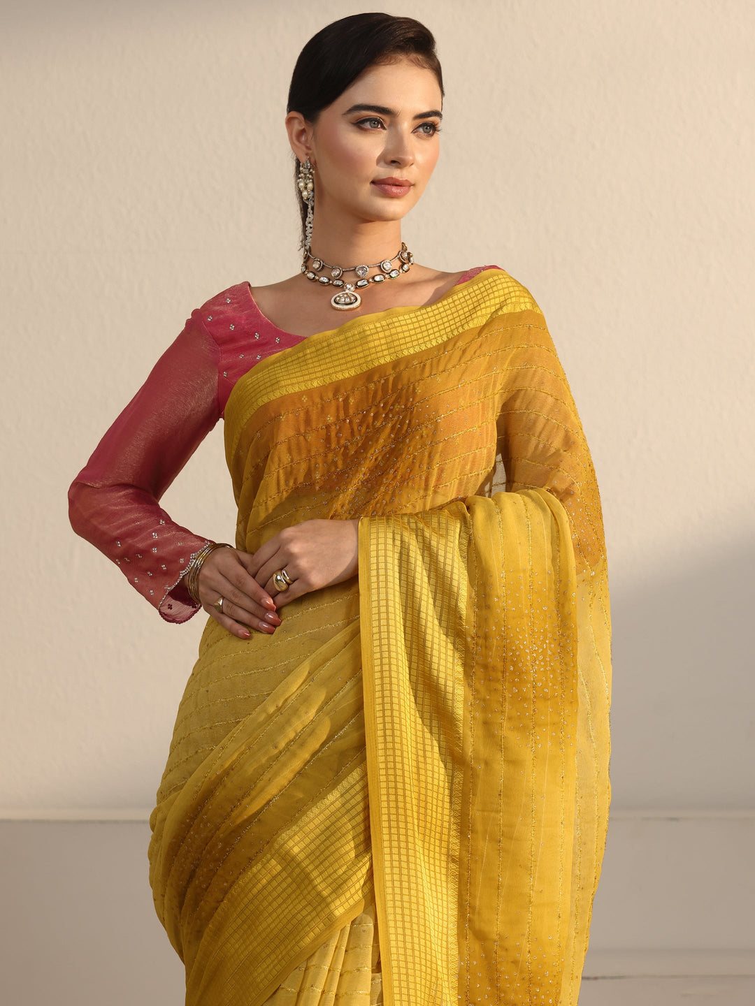  Libas Mustard Striped Georgette Tassel Saree with Embellishments 