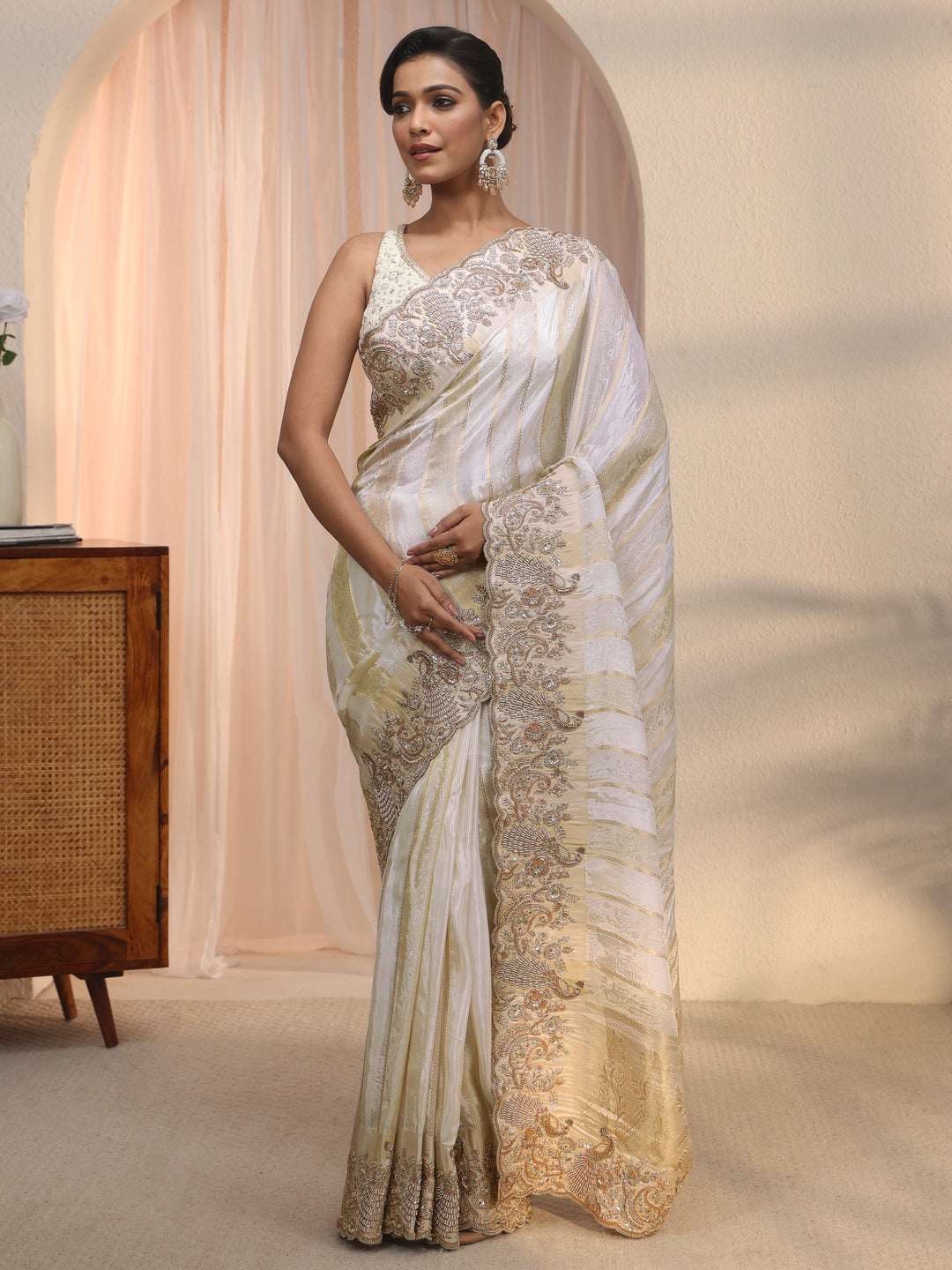  Libas Art Cream Woven Design Tissue Saree with Embellished Border 