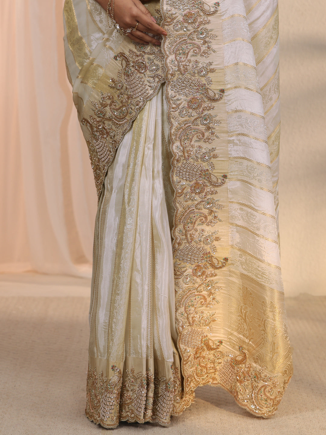  Libas Art Cream Woven Design Tissue Saree with Embellished Border 