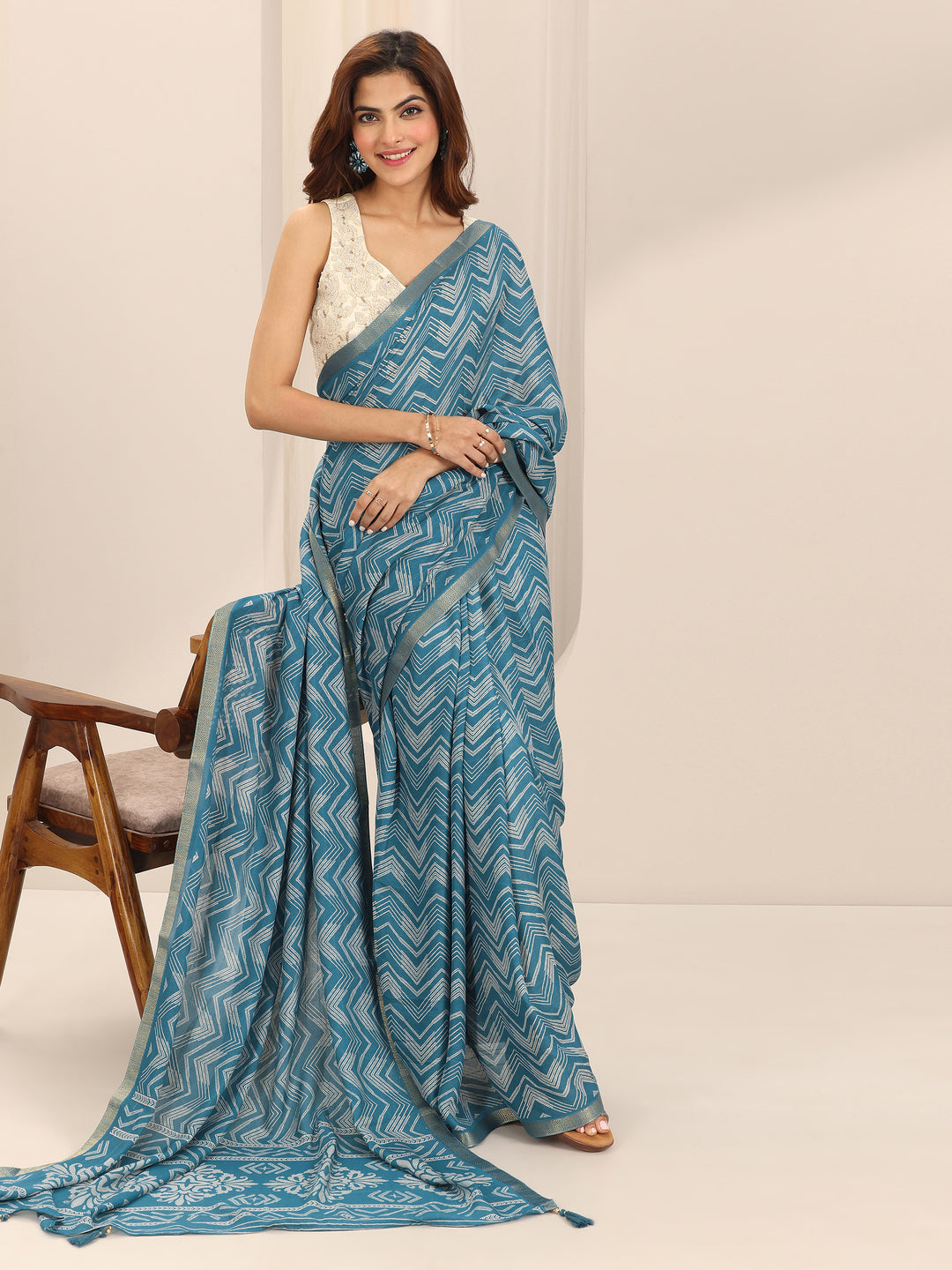  Turquoise Printed Georgette Saree With Unstitched Blouse Piece 