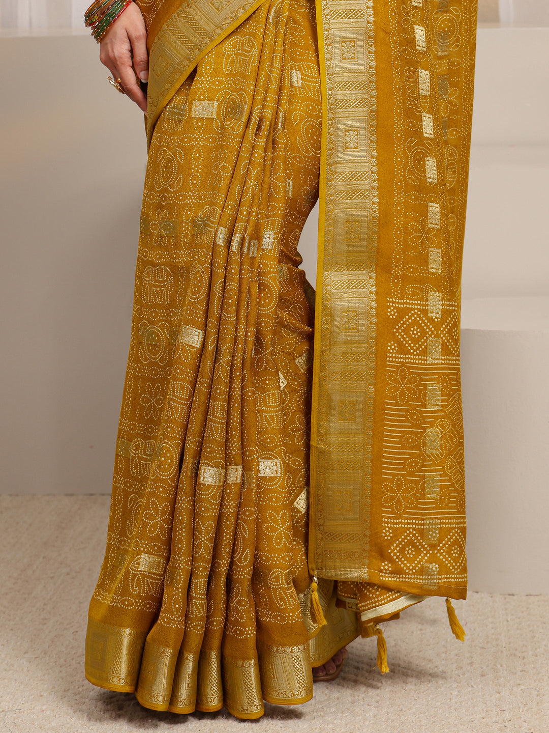  Mustard Bandhani Printed Silk Blend Saree 
With Unstitched Blouse Piece 