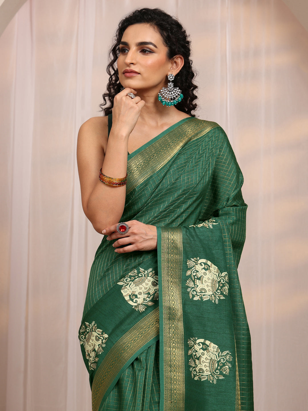  Green Ethnic Motif Woven Design Silk Blend Saree 
With Unstitched Blouse Piece 