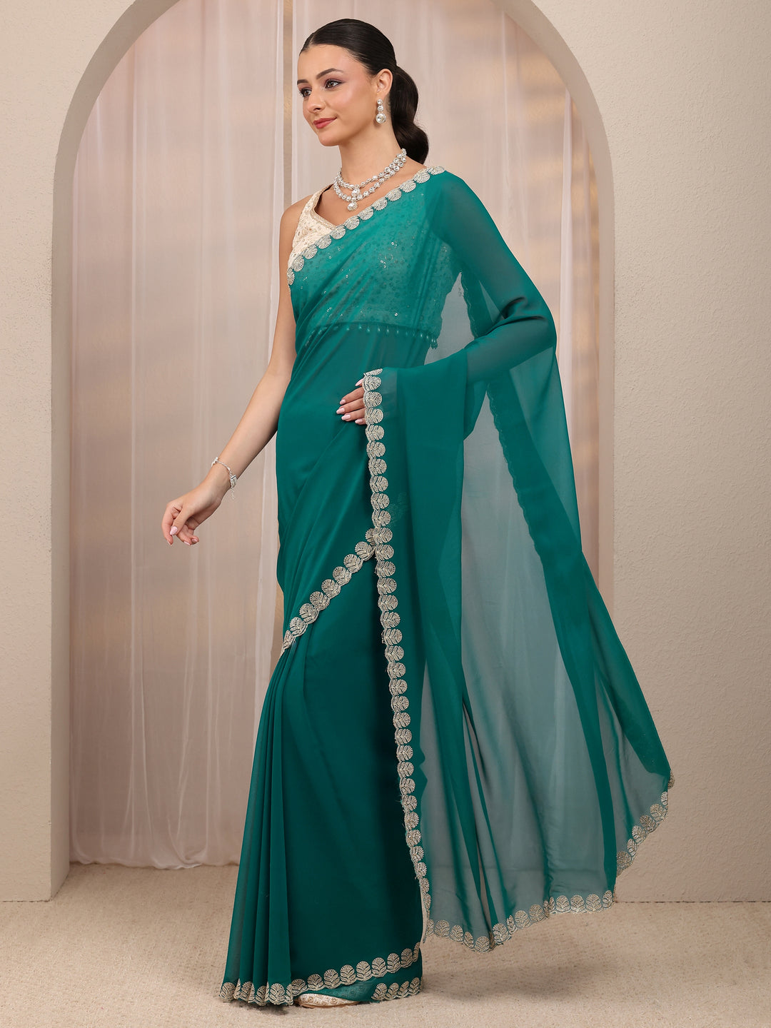  Teal Green Embellished Silk Blend Saree 
With Unstitched Blouse Piece 