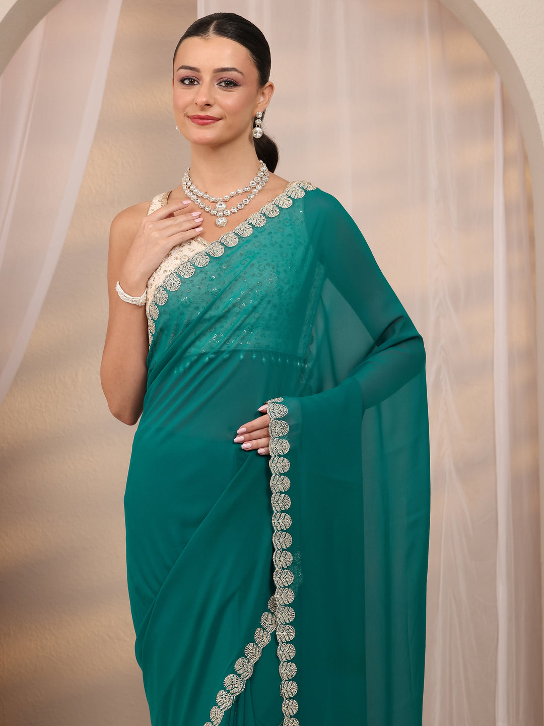  Teal Green Embellished Silk Blend Saree 
With Unstitched Blouse Piece 