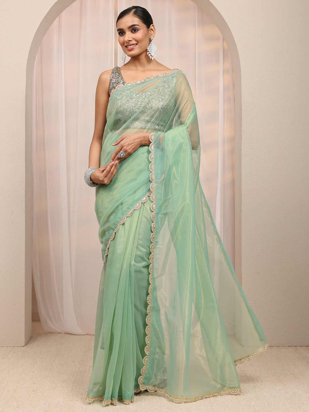  Green Embellished Sheen Net Saree 
With Unstitched Blouse Piece 