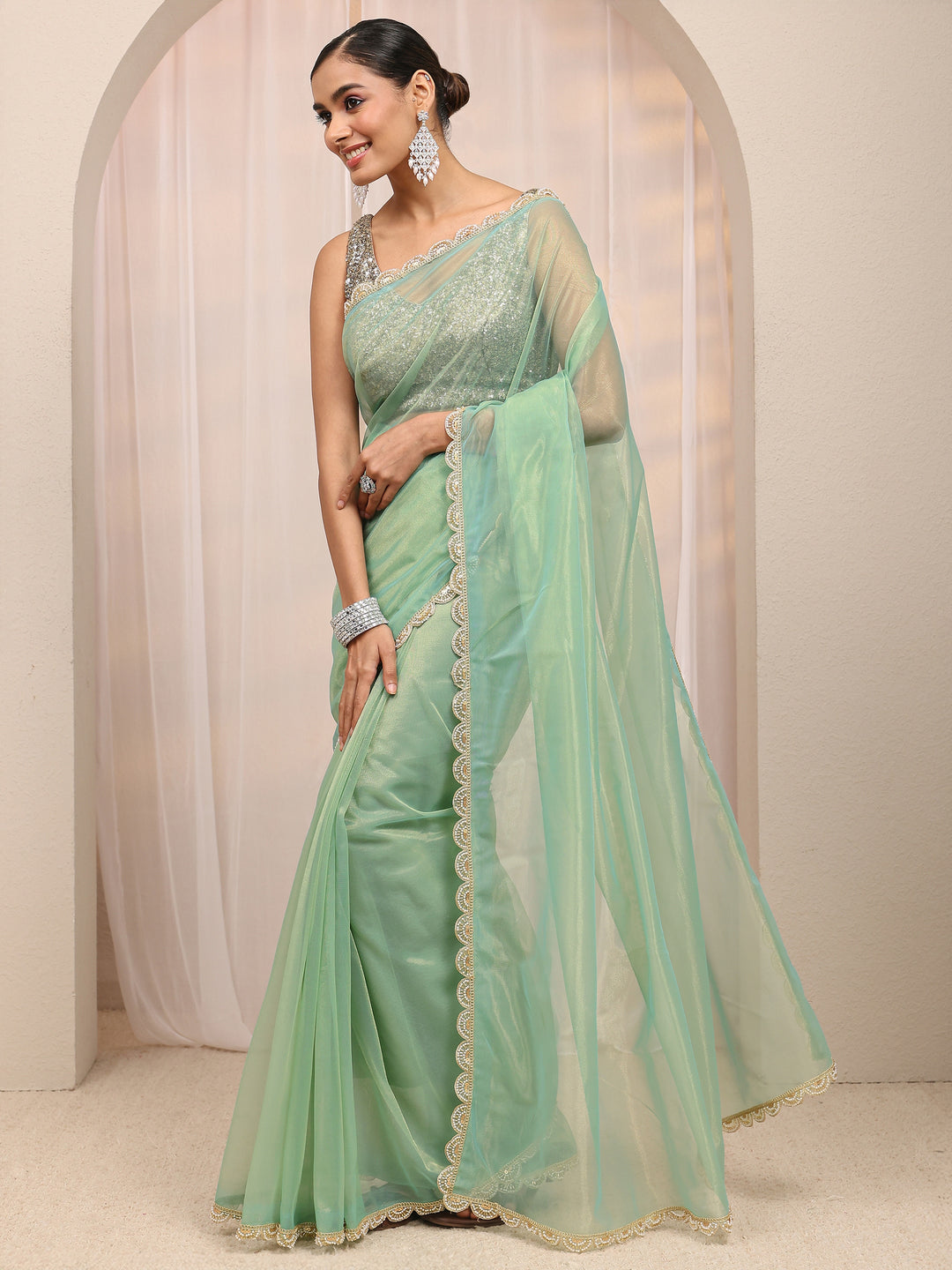  Green Embellished Sheen Net Saree 
With Unstitched Blouse Piece 