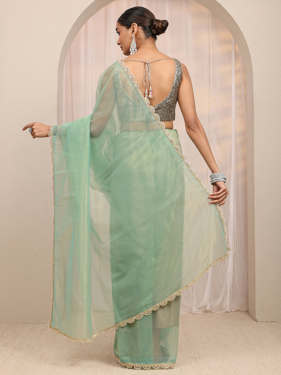  Green Embellished Sheen Net Saree 
With Unstitched Blouse Piece 