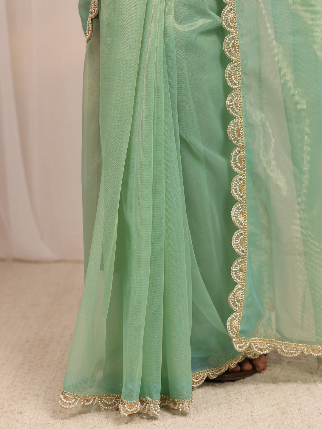  Green Embellished Sheen Net Saree 
With Unstitched Blouse Piece 