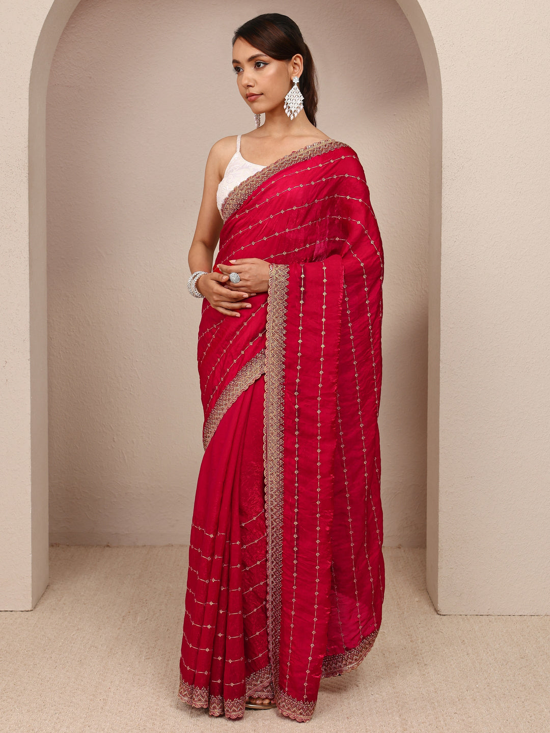  Red Embellished Silk Blend Saree
With Unstitched Blouse Piece 