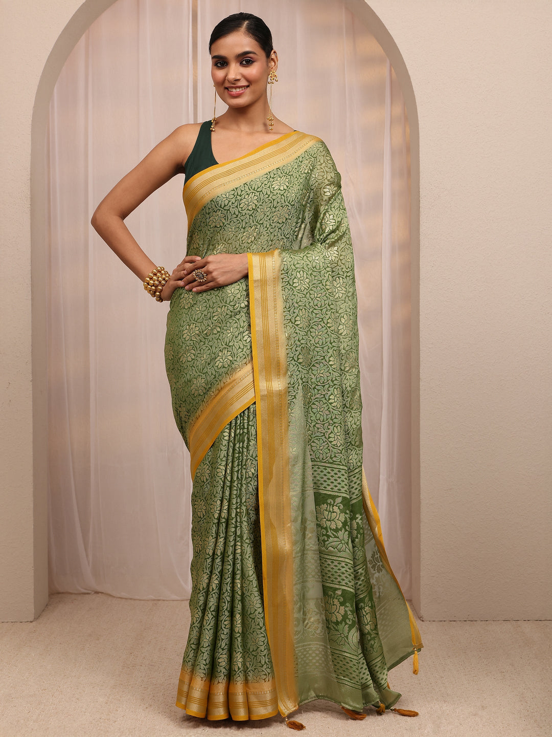  Green Woven Design Silk Blend Saree 
With Unstitched Blouse Piece 