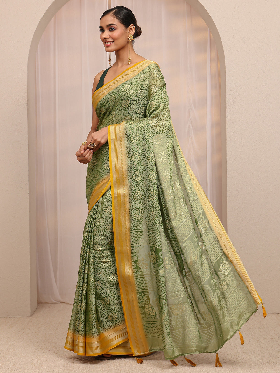  Green Woven Design Silk Blend Saree 
With Unstitched Blouse Piece 