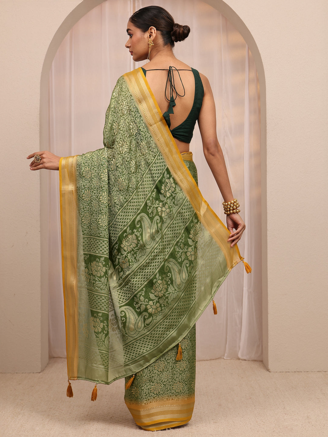  Green Woven Design Silk Blend Saree 
With Unstitched Blouse Piece 