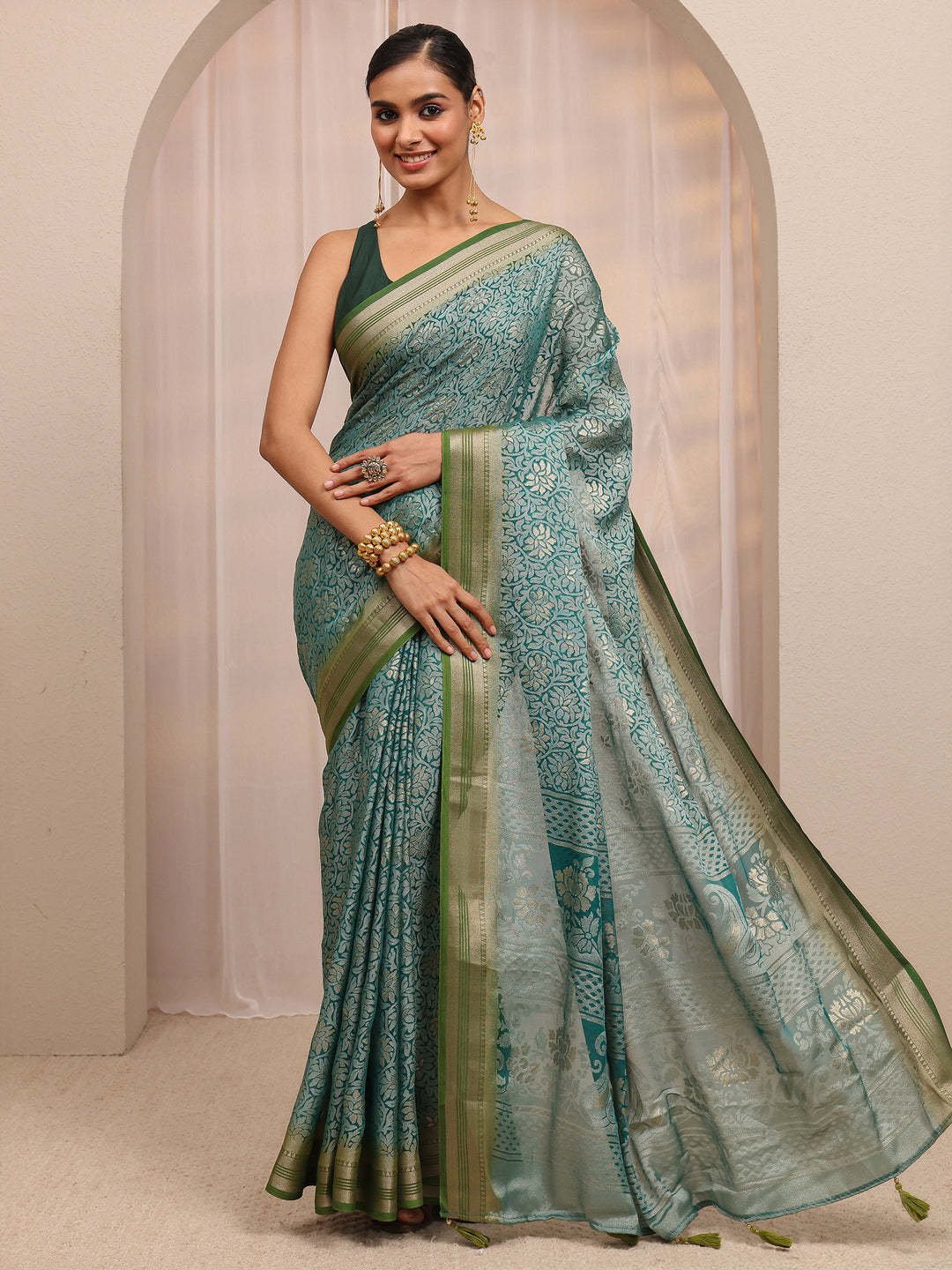  Green Woven Design Silk Blend Saree 
With Unstitched Blouse Piece 