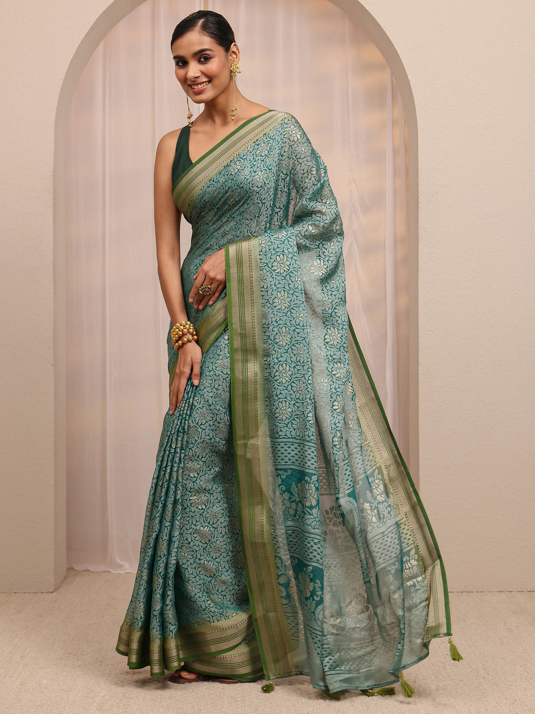  Green Woven Design Silk Blend Saree 
With Unstitched Blouse Piece 