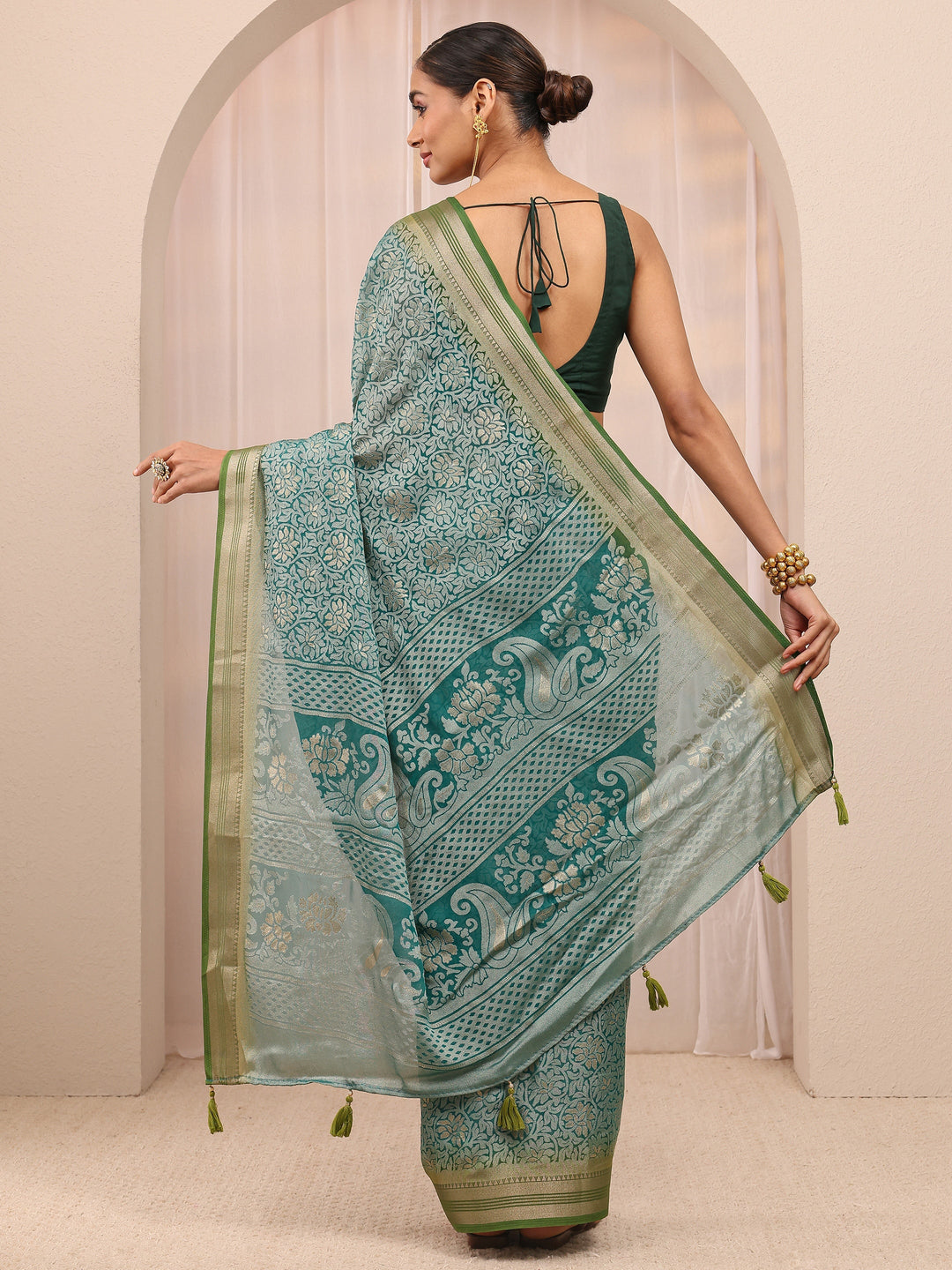  Green Woven Design Silk Blend Saree 
With Unstitched Blouse Piece 