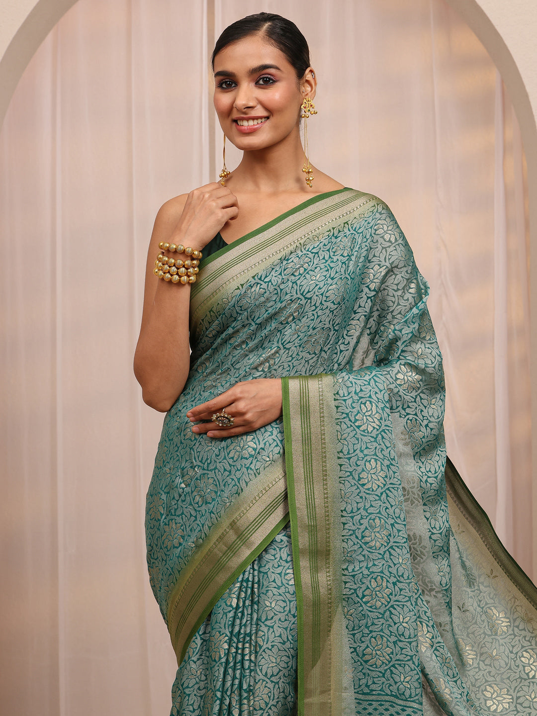  Green Woven Design Silk Blend Saree 
With Unstitched Blouse Piece 