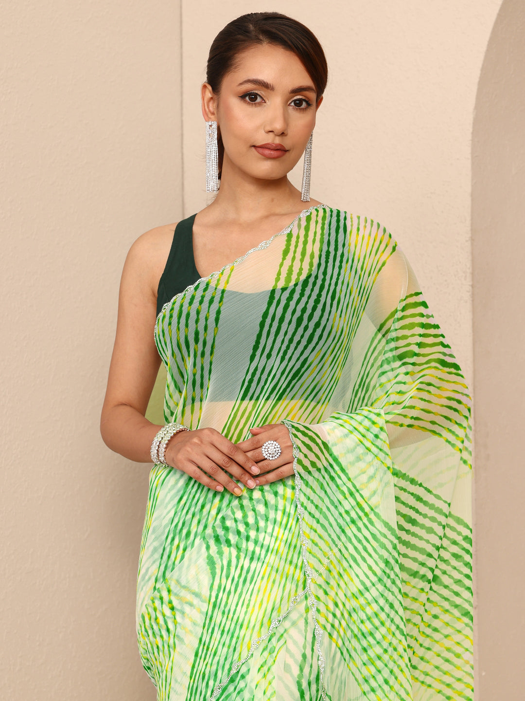  Green Leheriya Printed Chiffon Saree
With Unstitched Blouse Piece 