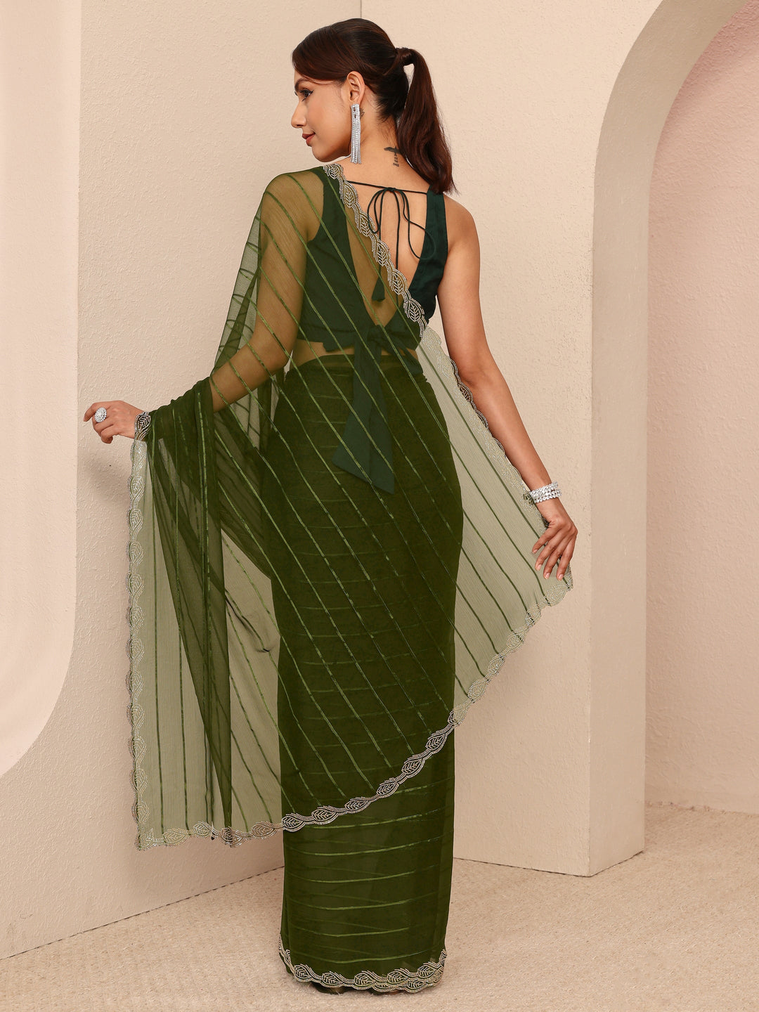  Green Striped Embellished Silk Blend Saree
With Unstitched Blouse Piece 