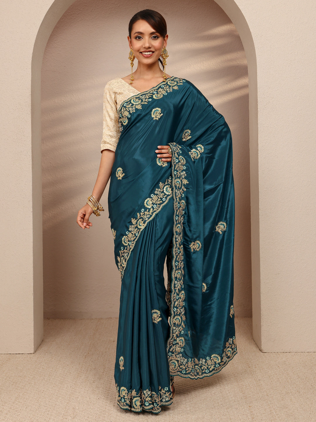  Teal Floral Embroidered Satin Saree
With Unstitched Blouse Piece 