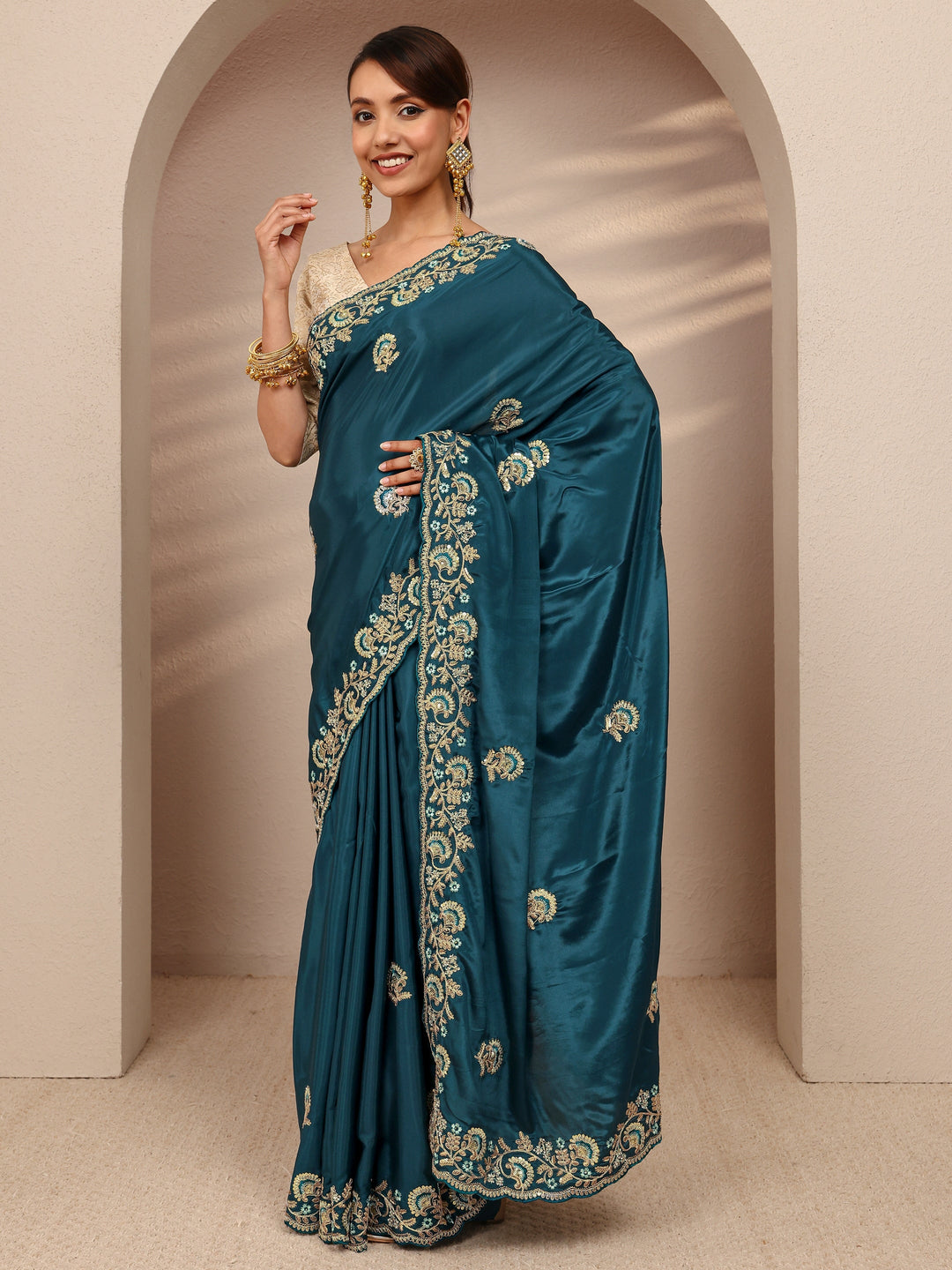  Teal Floral Embroidered Satin Saree
With Unstitched Blouse Piece 