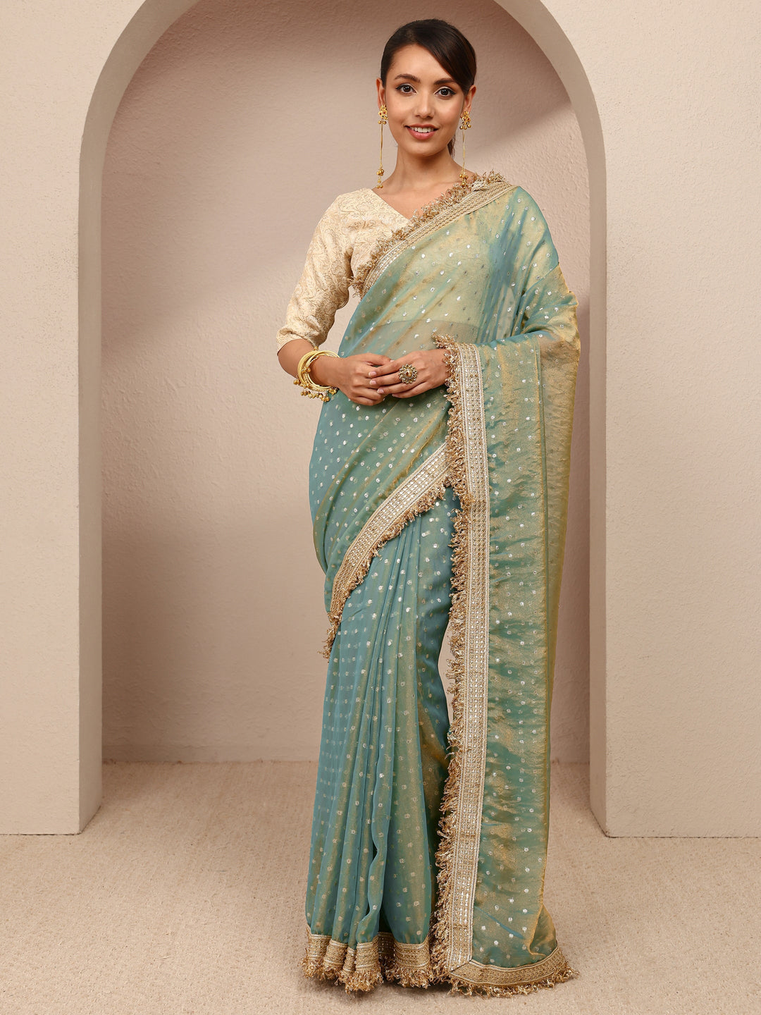  Green Woven Design Tissue Saree
With Unstitched Blouse Piece 