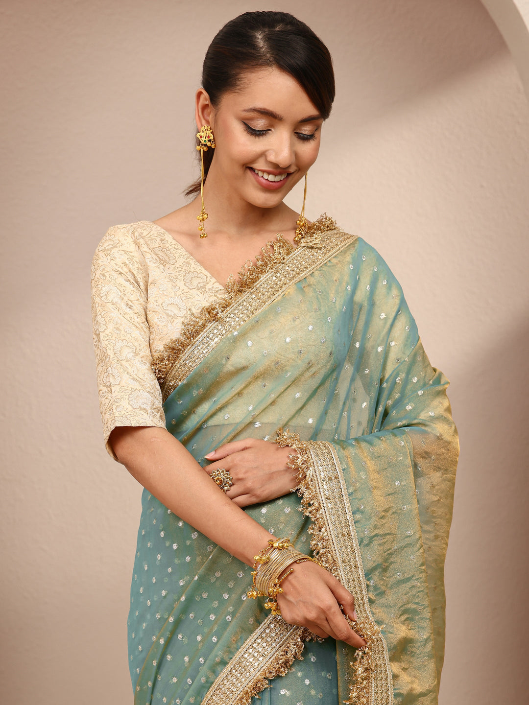  Green Woven Design Tissue Saree
With Unstitched Blouse Piece 