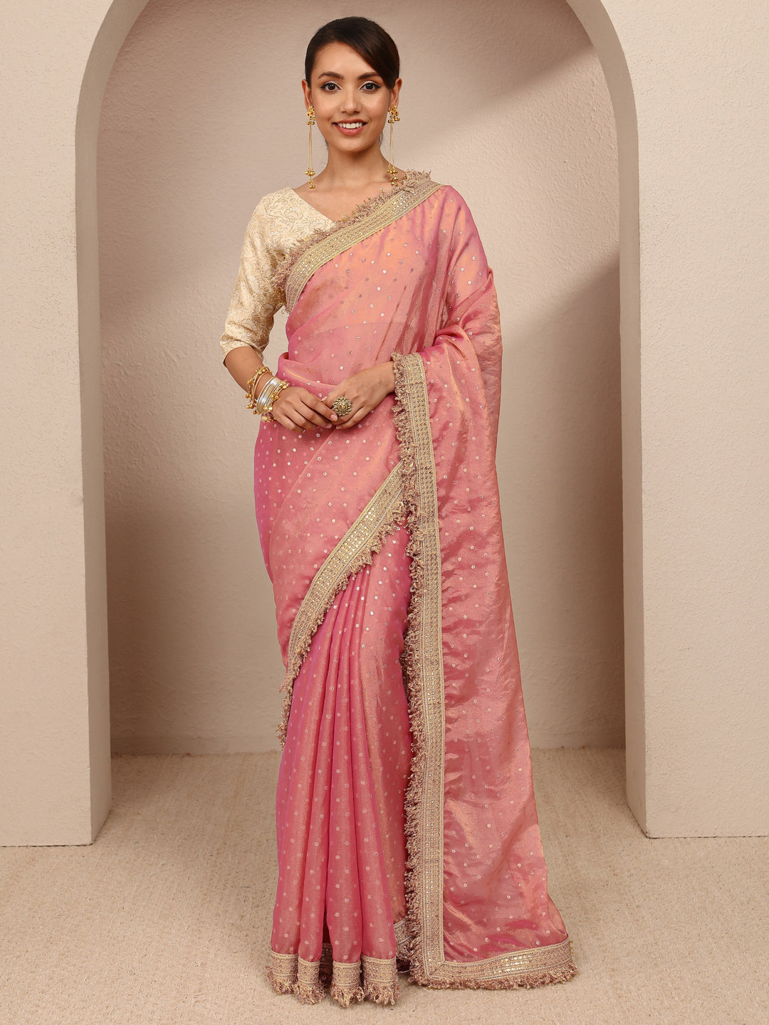  Pink Woven Design Tissue Saree
With Unstitched Blouse Piece 