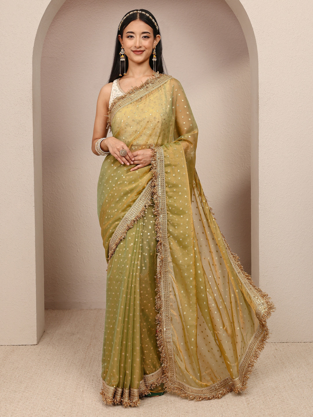  Green Woven Design Tissue Saree
With Unstitched Blouse Piece 