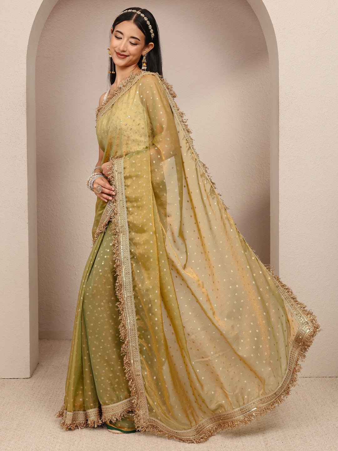  Green Woven Design Tissue Saree
With Unstitched Blouse Piece 