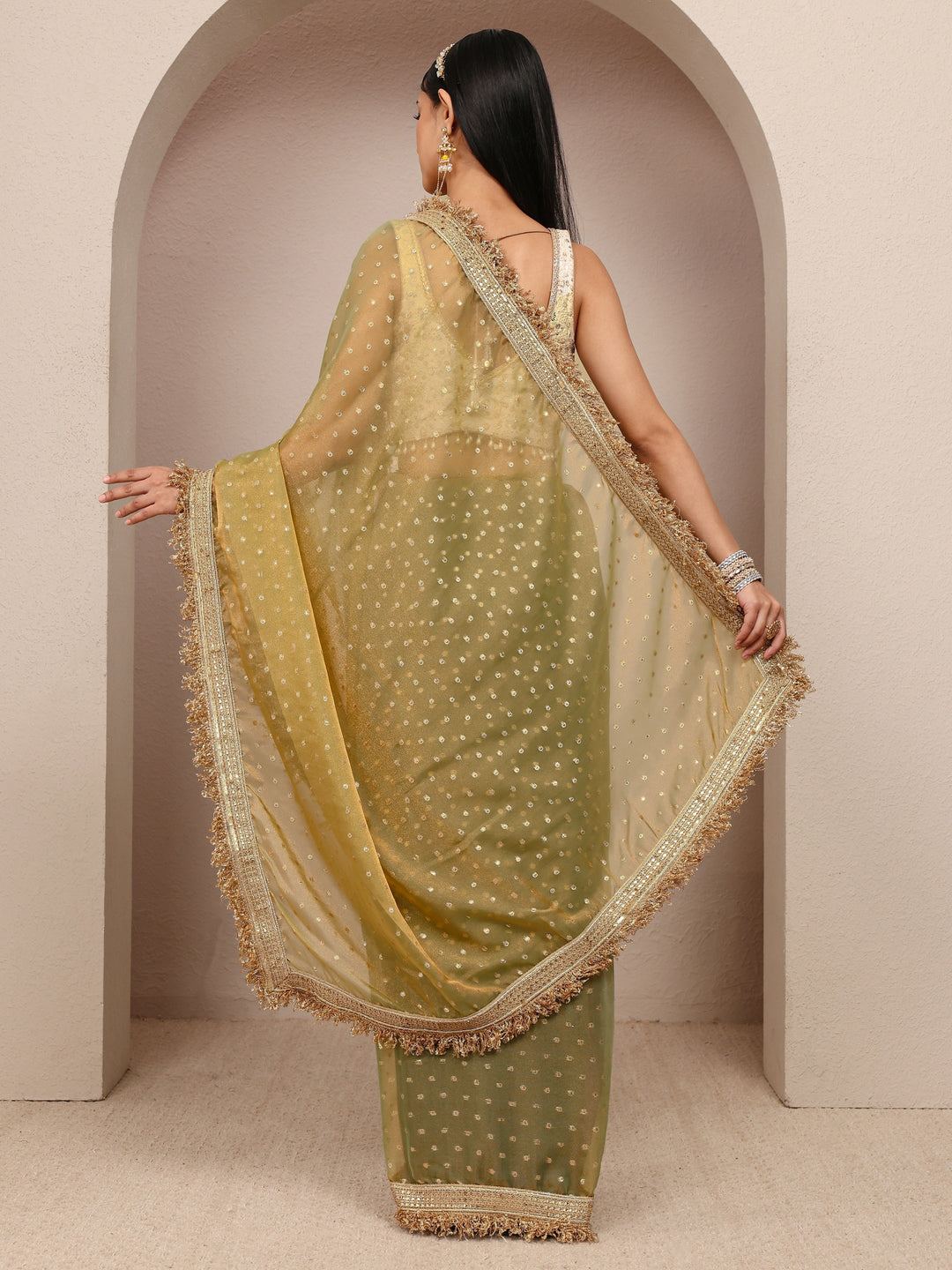  Green Woven Design Tissue Saree
With Unstitched Blouse Piece 