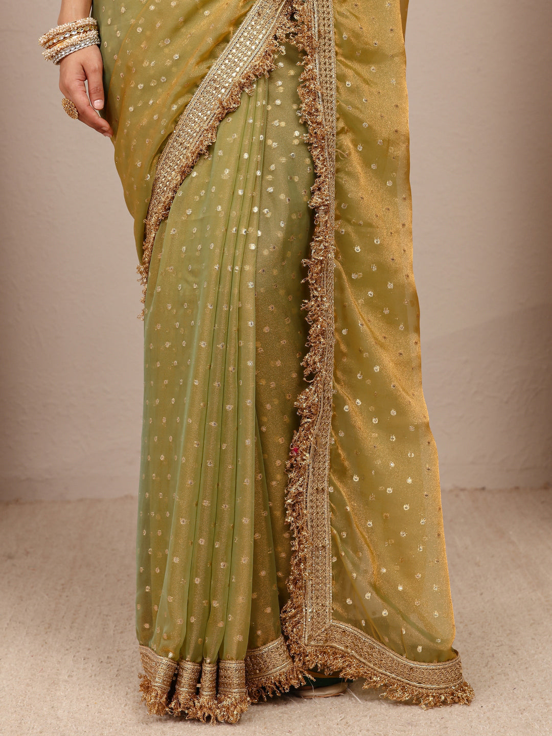  Green Woven Design Tissue Saree
With Unstitched Blouse Piece 