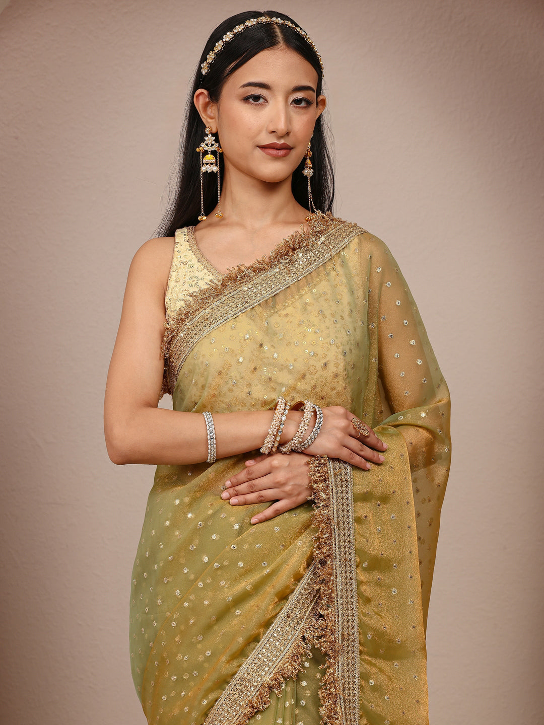  Green Woven Design Tissue Saree
With Unstitched Blouse Piece 