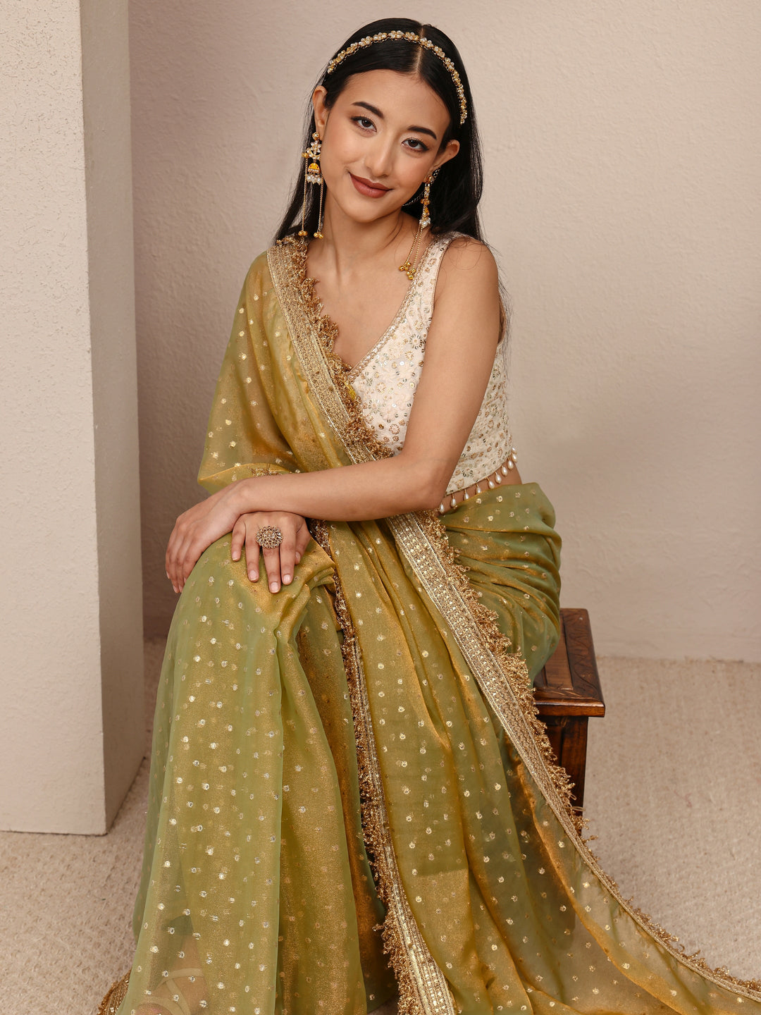  Green Woven Design Tissue Saree
With Unstitched Blouse Piece 