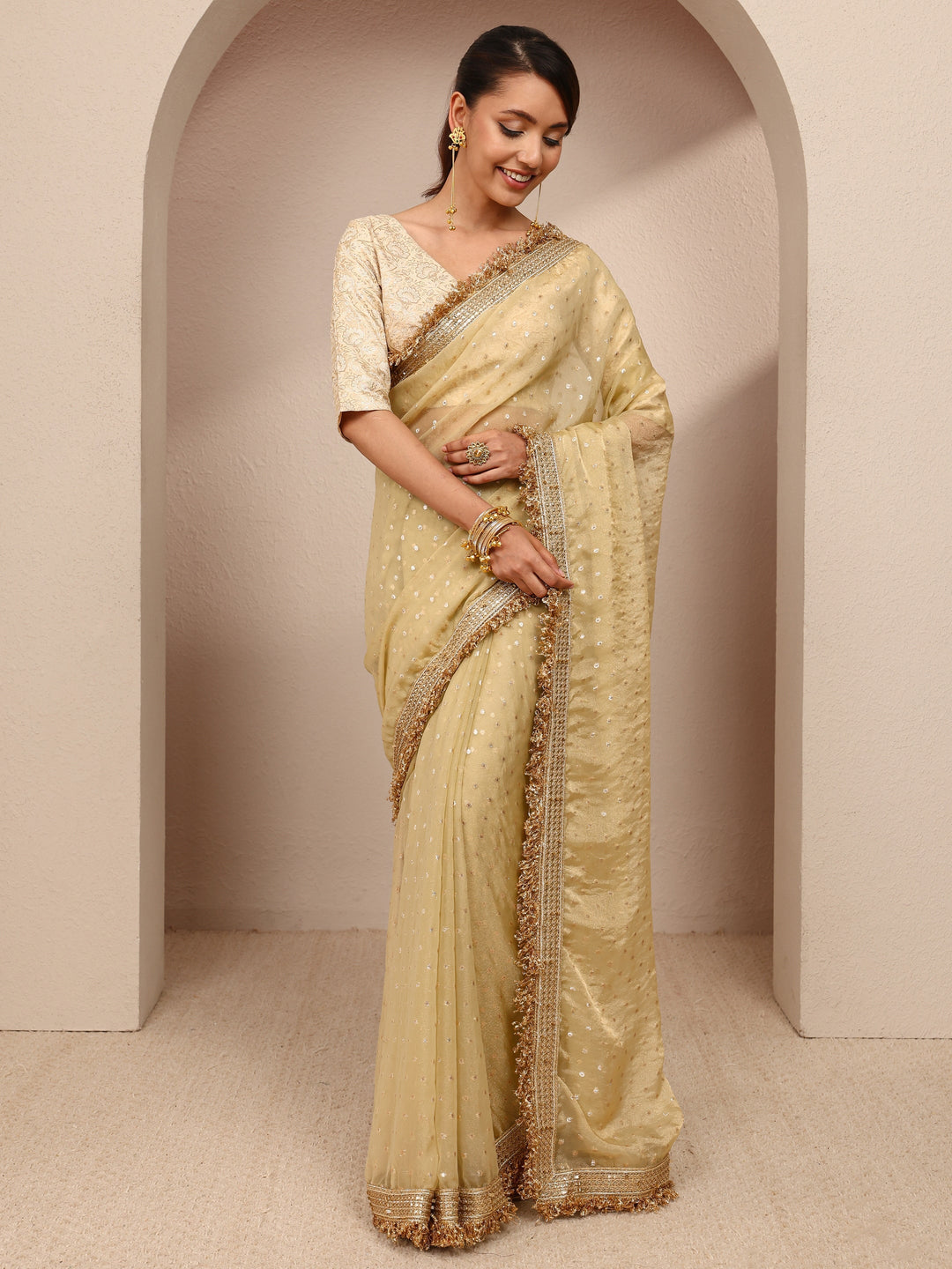  Gold Woven Design Tissue Saree
With Unstitched Blouse Piece 