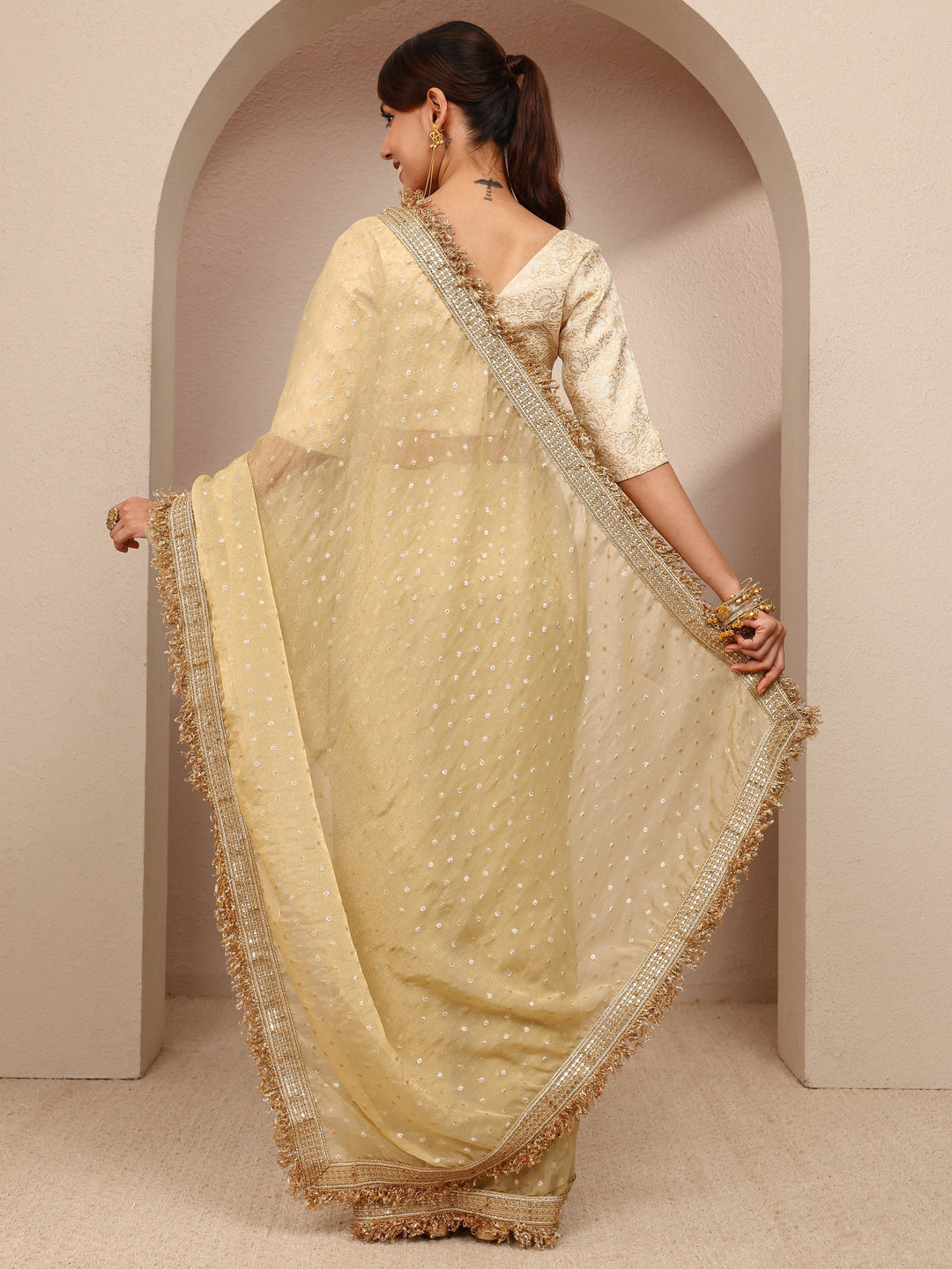  Gold Woven Design Tissue Saree
With Unstitched Blouse Piece 